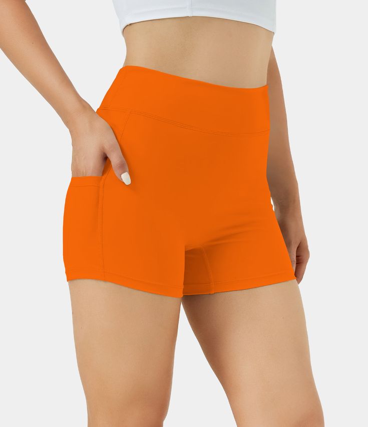 Add a pop of energy to your activewear with Orange Biker Shorts. High-performance, moisture-wicking fabric ensures comfort and style during workouts or casual wear.